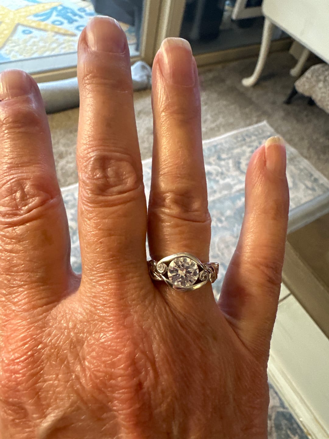 Customer photo review of Bezel Set Round Moissanite Scroll Accents Engagement Ring
