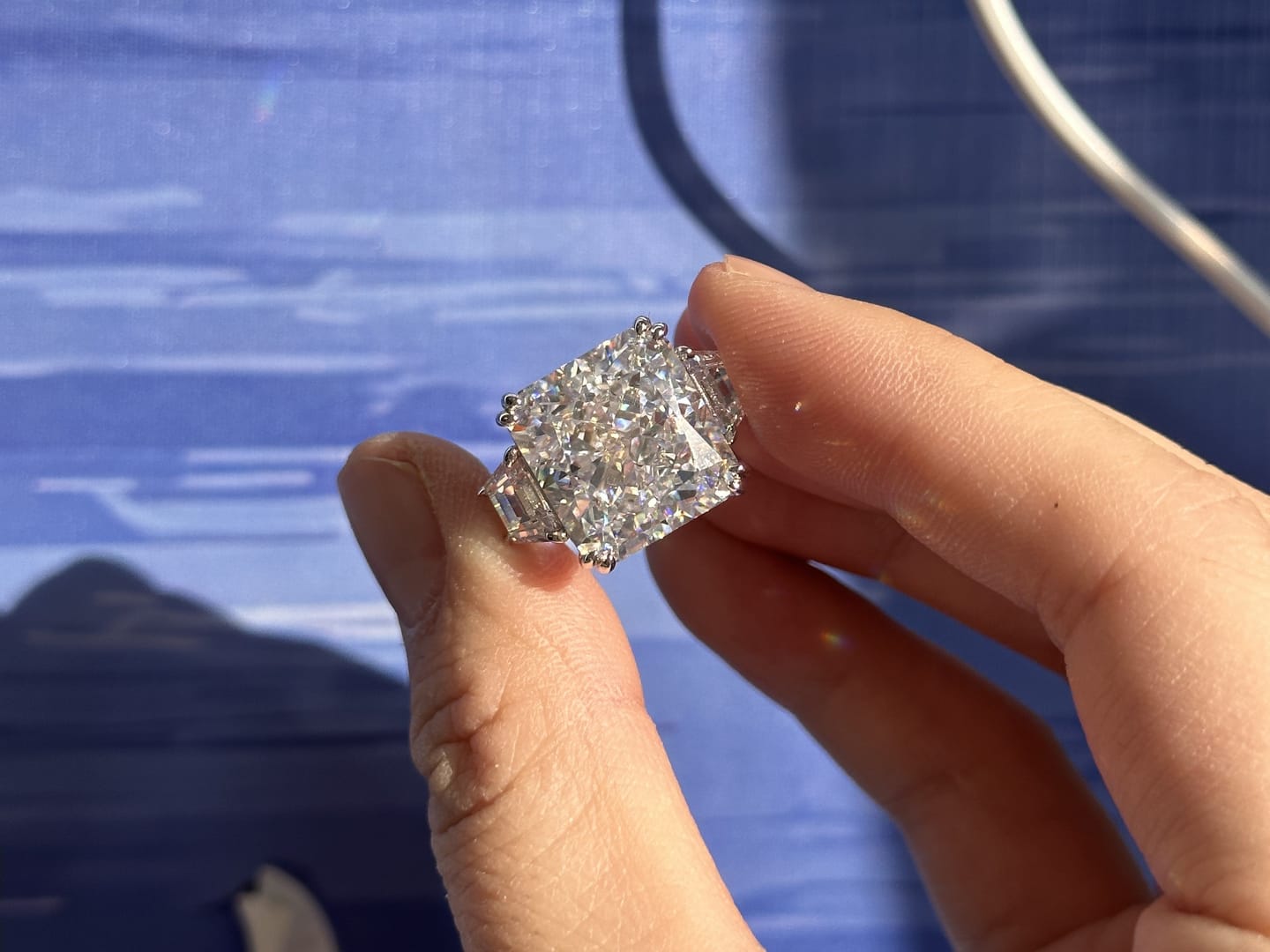 Customer photo review of S925 6.5/12.0 Ct Radiant Cut Crushed Ice Simulated Diamond Three-Stone Engagement Travel Ring