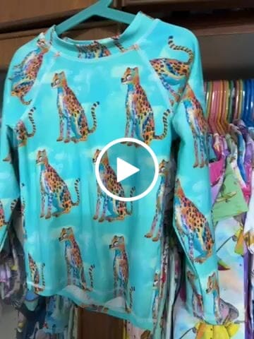 Customer video review of Shimmering Cheetah Kids' Rash Top