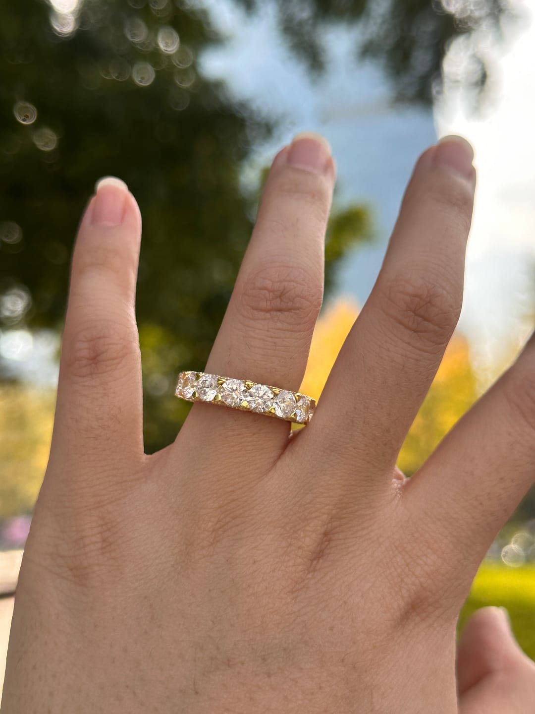 Customer photo review of Louily 5 Ct Luxury Eternity Round Cut Wedding Band In Sterling Silver