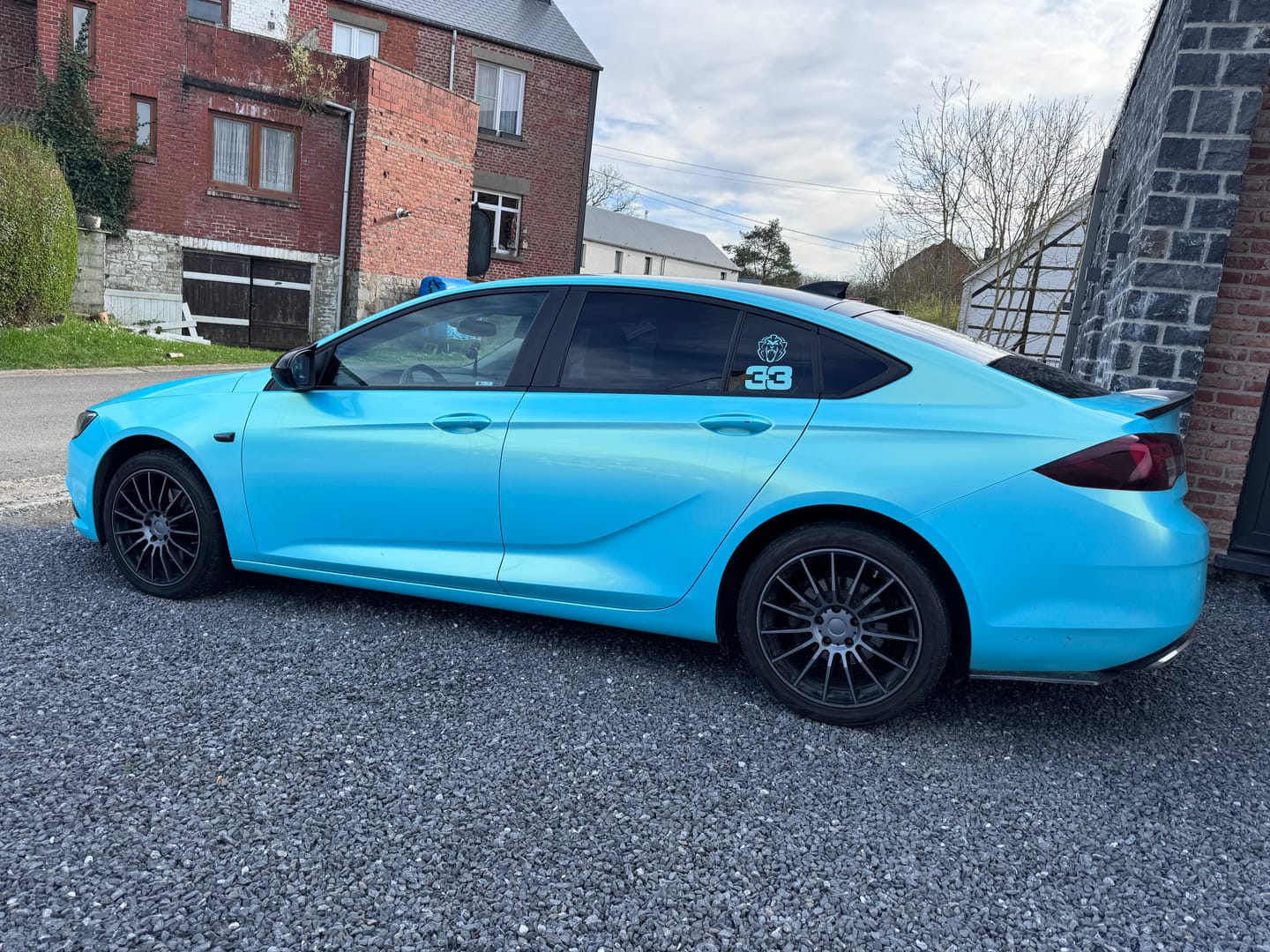 Customer photo review of Candy Metallic Neon Ice Blue Vinyl Wrap
