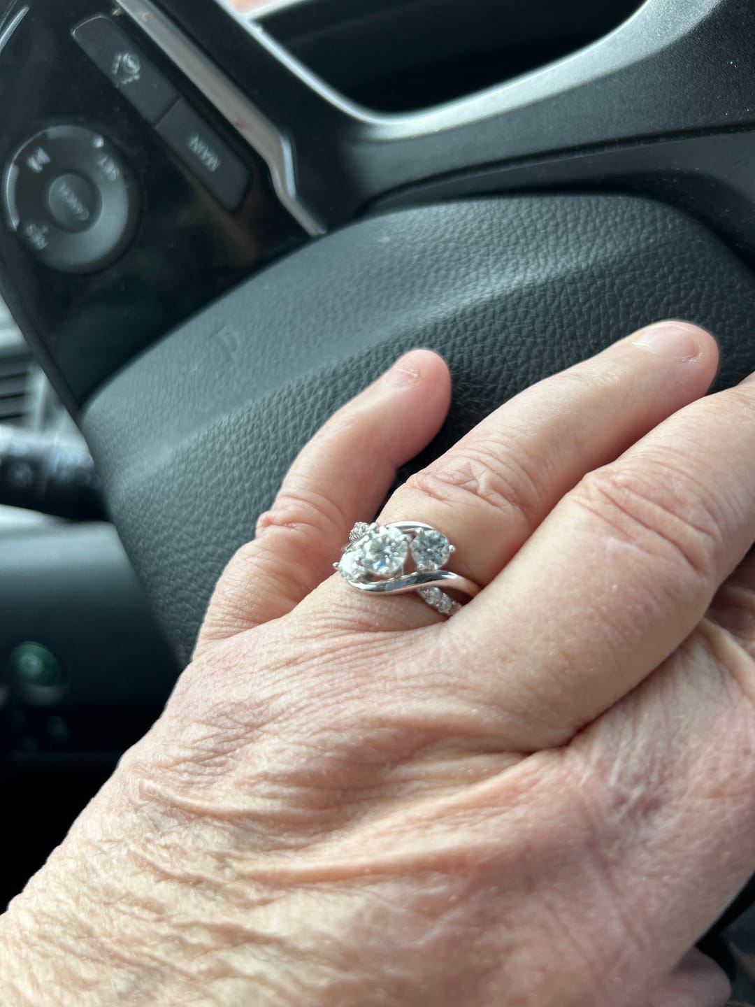 Customer photo review of Swirl Three Stone Moissanite Twisted Pave Engagement Ring