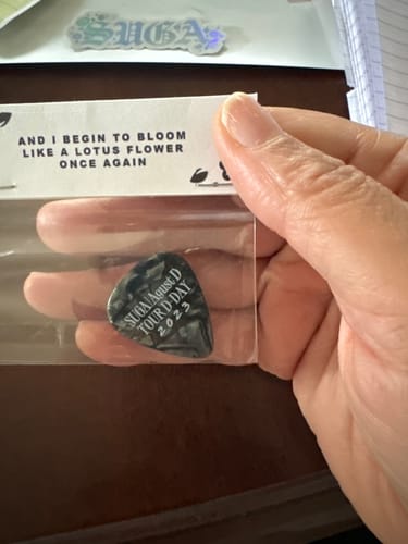 Customer photo review of BTS Suga D-Day Tour Guitar Pick