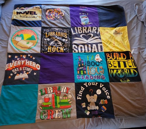 T-shirt quilt with reading, libraries themes by Carol from WA