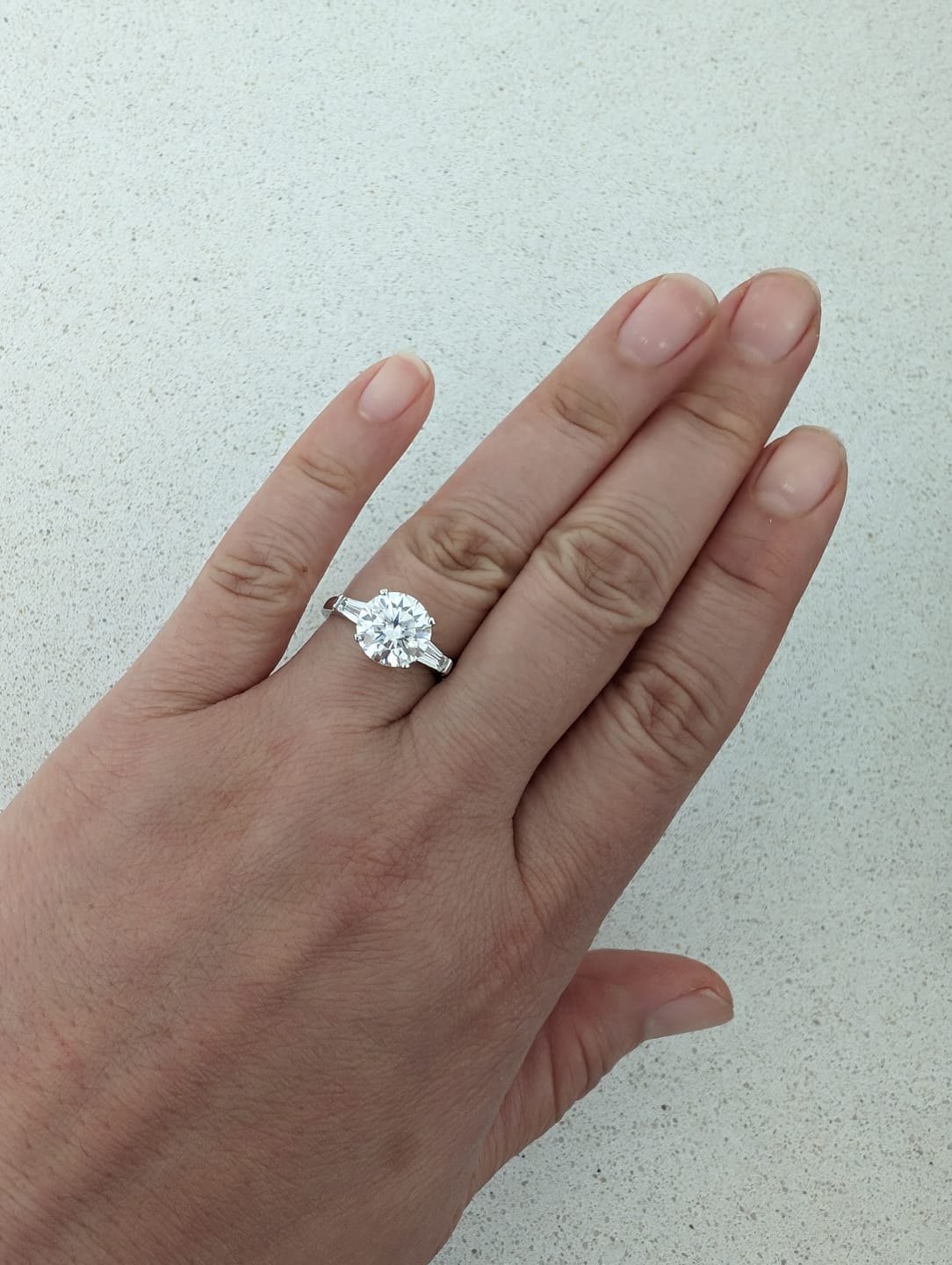 Customer photo review of Three Stone Round Moissanite Tapered Baguette Engagement Ring
