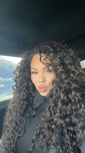 Customer photo review of Natural Black Curly Clip-In Hair Extensions