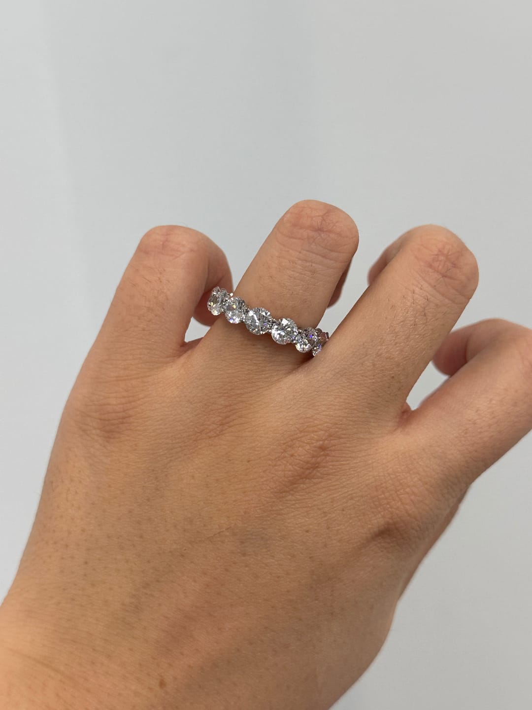 Customer photo review of Louily Classic Eternity Round Cut Women's Wedding Band In Sterling Silver