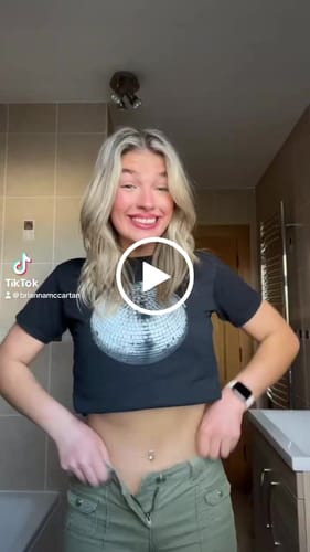 Customer video review of 'Studio 54' baby tee