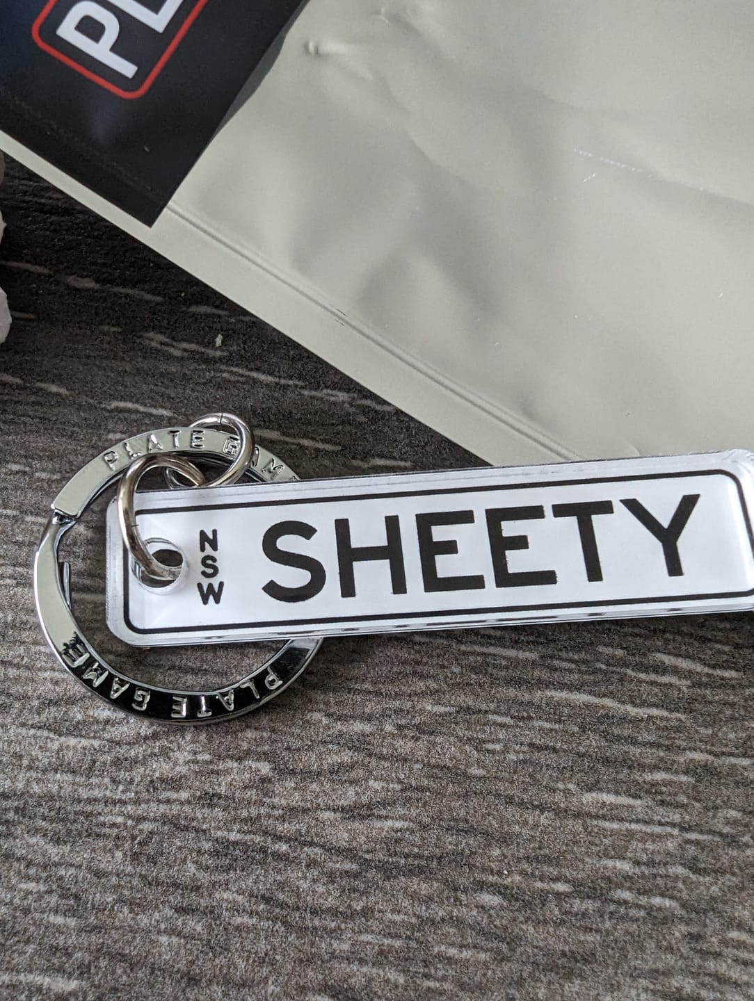 Customer photo review of NSW Colour on White Licence Plate Custom Keychain