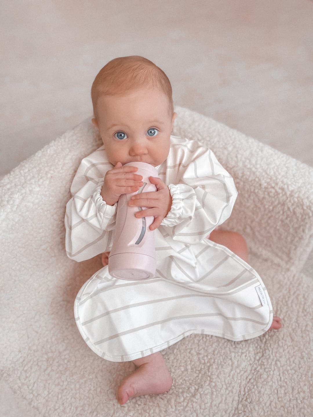 Customer photo review of Mess-Free Smock Bib | Beige Stripe