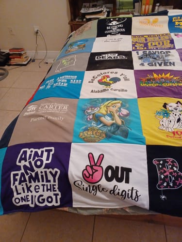 T-shirt quilt with family, community themes by Joyce from FL
