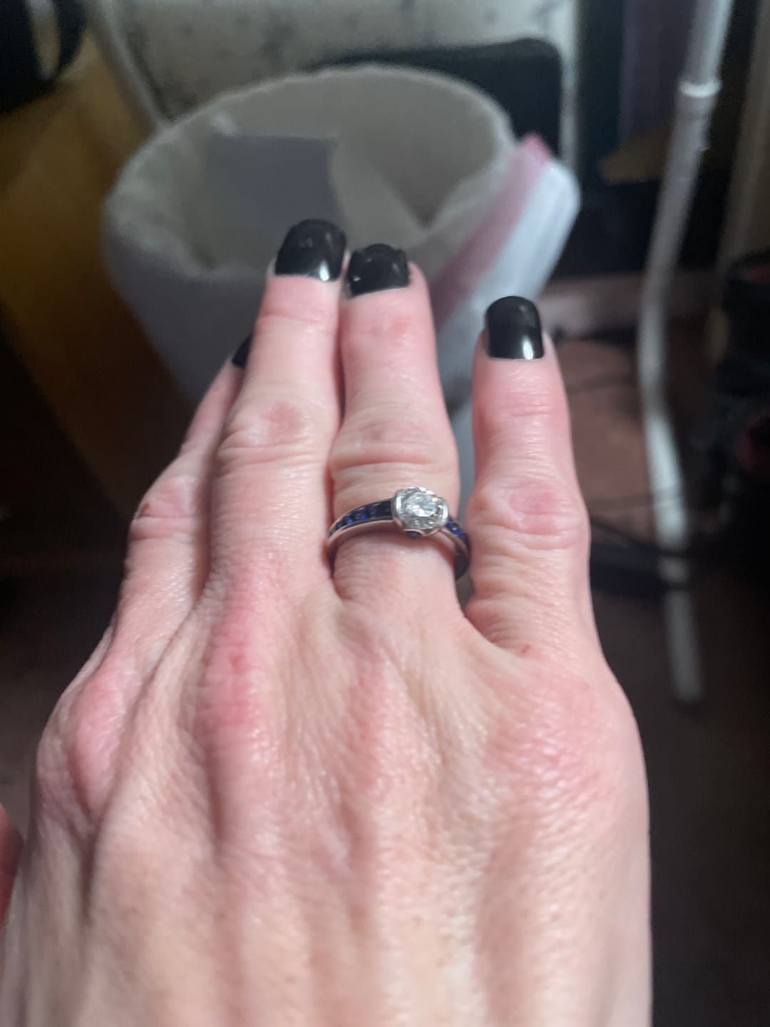 Customer photo review of Half Bezel Moissanite With Sapphire Channel Set Engagement Ring