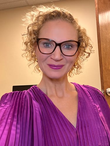 Customer photo review of Huggie Hoop Earrings