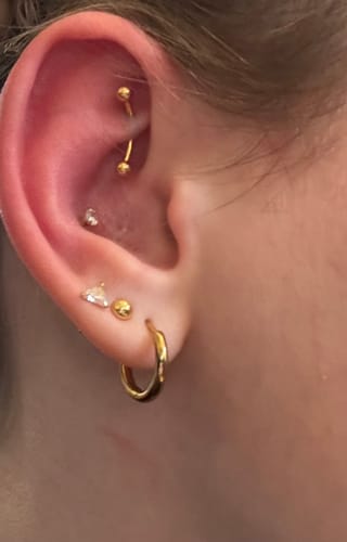Customer photo review of Banana Rook Piercing Gold