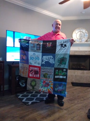 T-shirt quilt with travel, food and drink themes by Jordan from LA