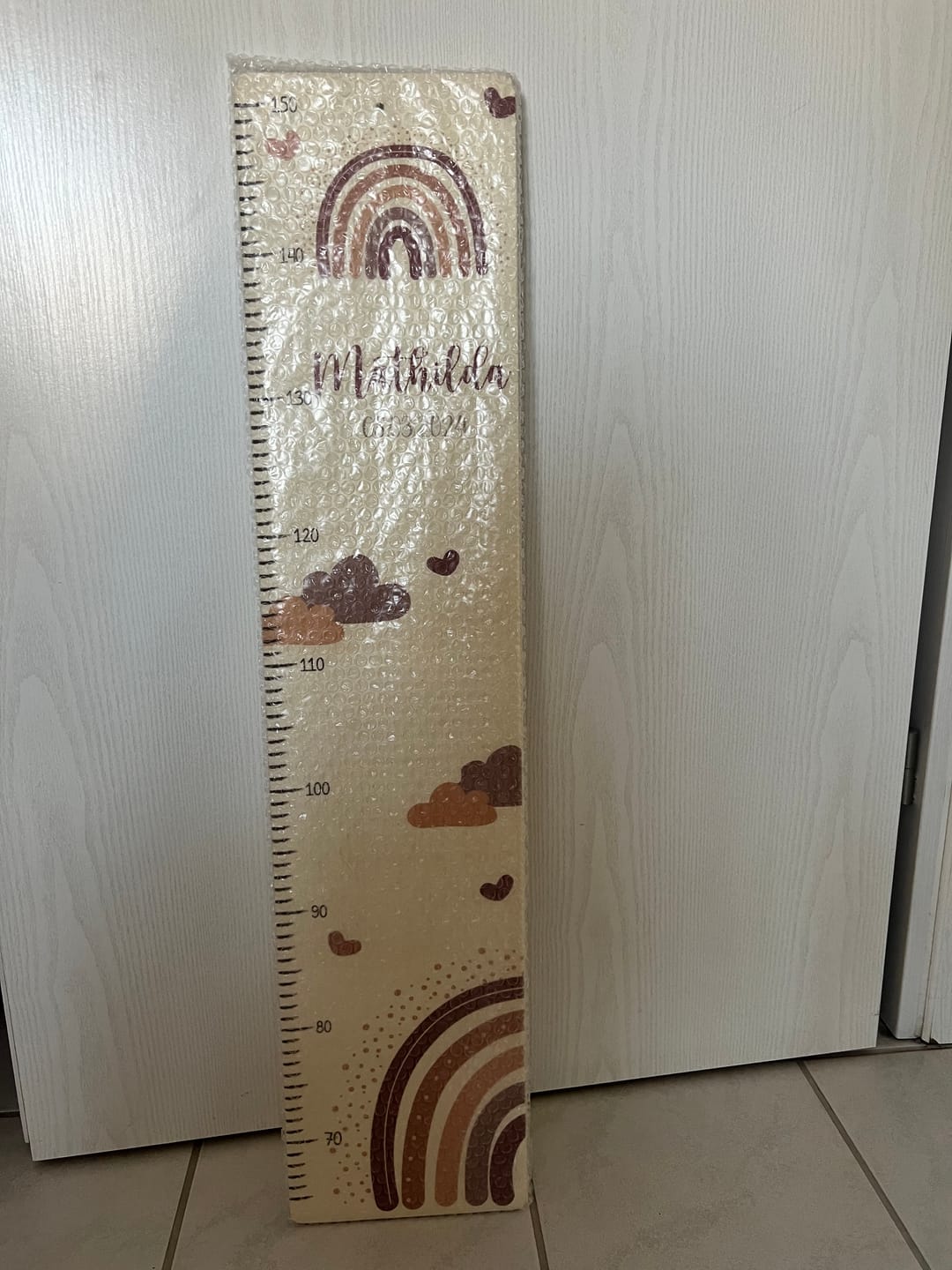Customer photo review of Personalisierte Messlatte Regenbogen & Wolken