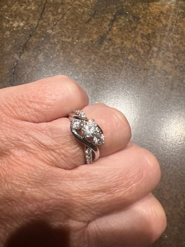 Customer photo review of Swirl Three Stone Moissanite Twisted Pave Engagement Ring
