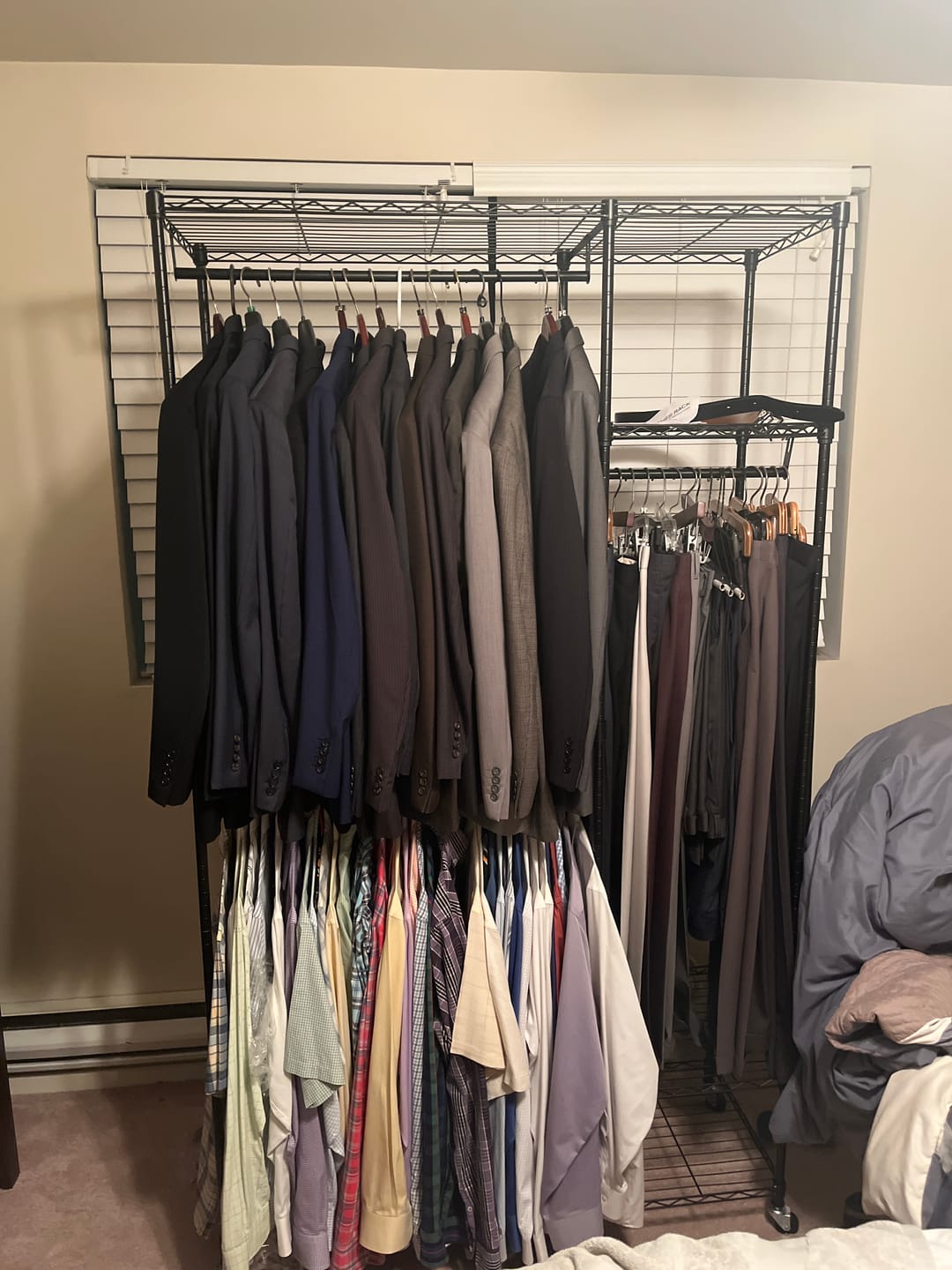 Customer photo review of Raybee Heavy Duty Portable Clothes Rack With Wheels,Clothing Rack For Hanging,Garment Rack For Bedroom