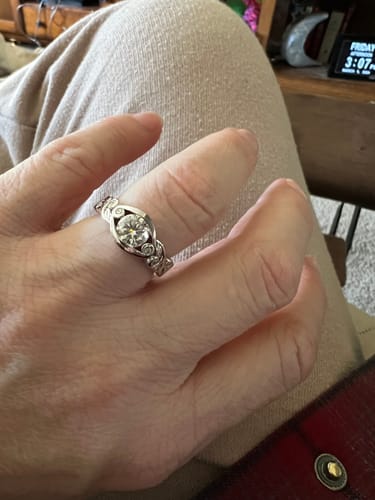 Customer photo review of Bezel Set Round Moissanite Scroll Accents Engagement Ring