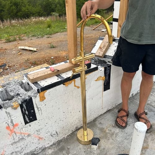 Customer photo review of Unlacquered Solid Brass Tub Filler and Handheld Standing Two Outlets Bathtub Faucet