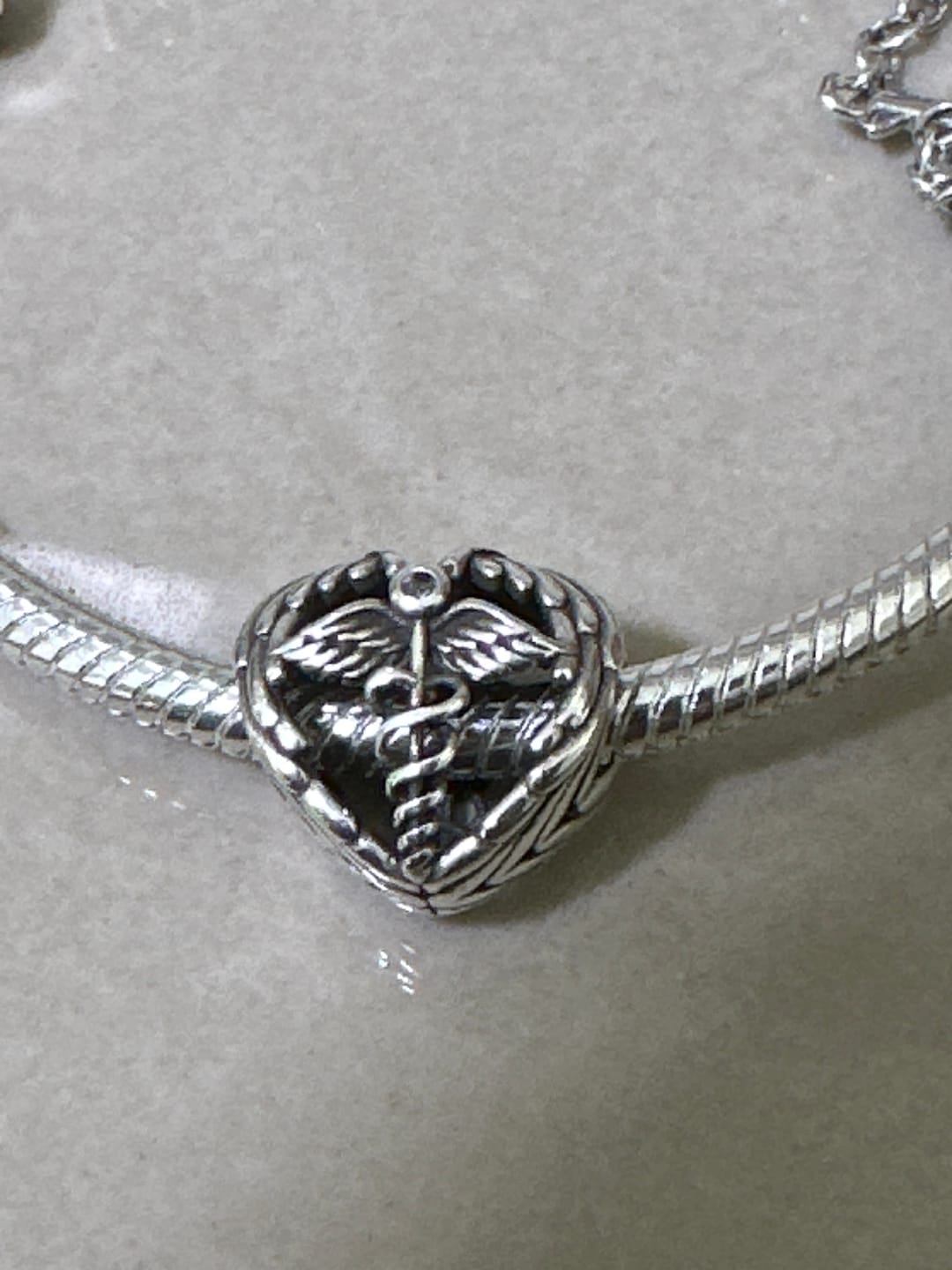 Customer photo review of Charm Corazon Medico