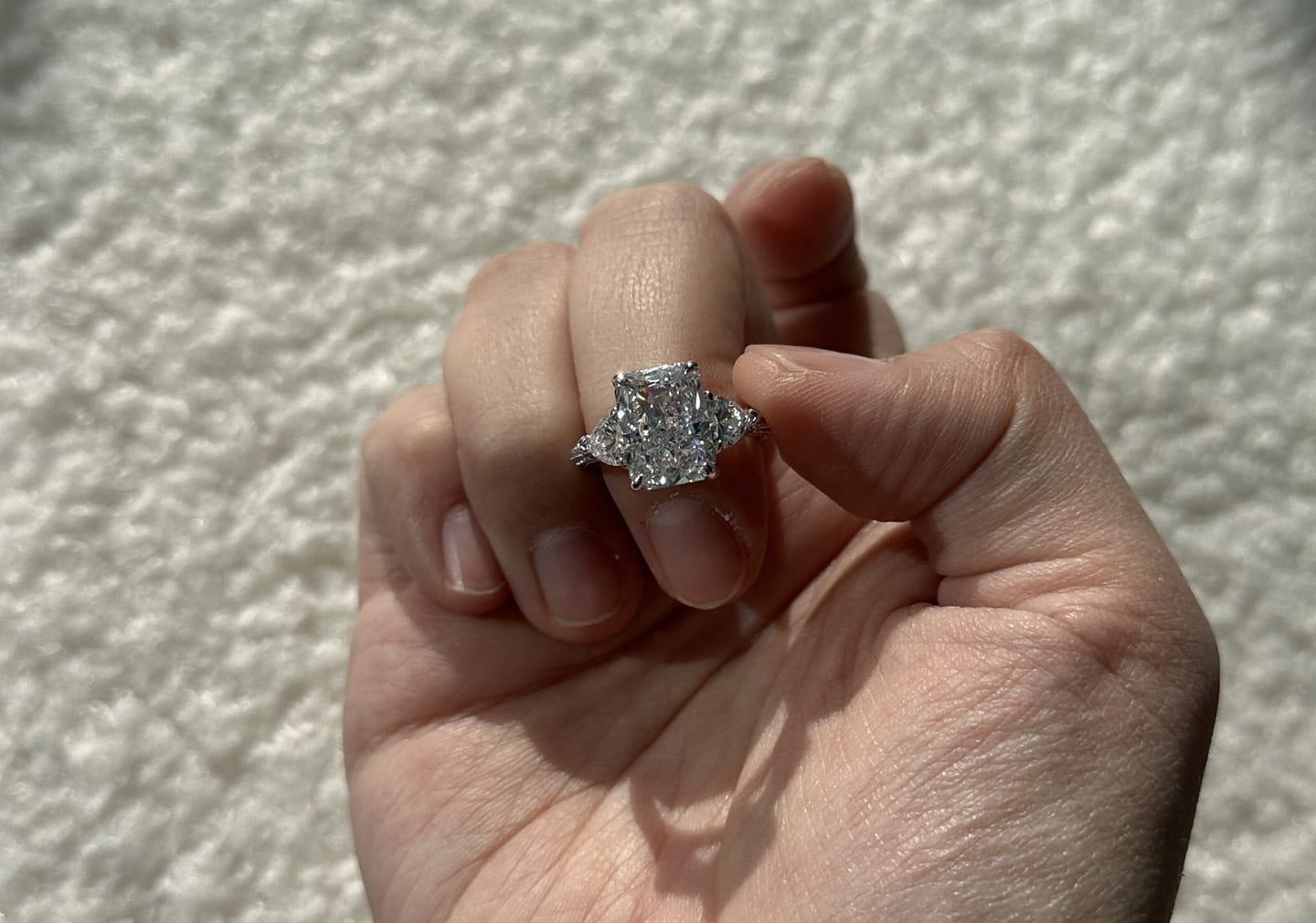 Customer photo review of Louily 5.0 Carat Radiant Cut Three Stone Engagement Ring With Two Heart Cut Side Stones