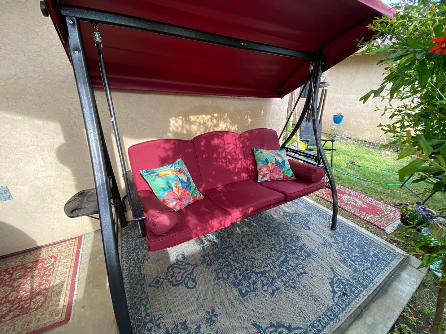 Customer photo review of 3-Seat Outdoor Porch Swing with Adjustable Canopy Backrest and 2 Side Trays (Wine Red)