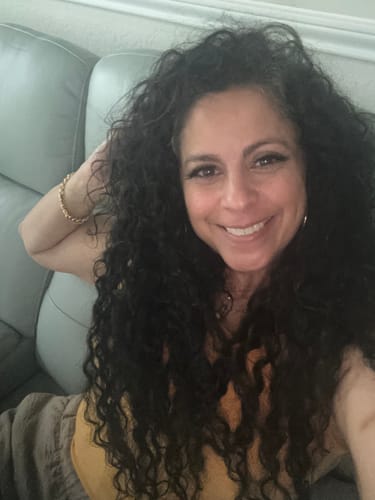 Customer photo review of Natural Black Curly Clip-In Hair Extensions