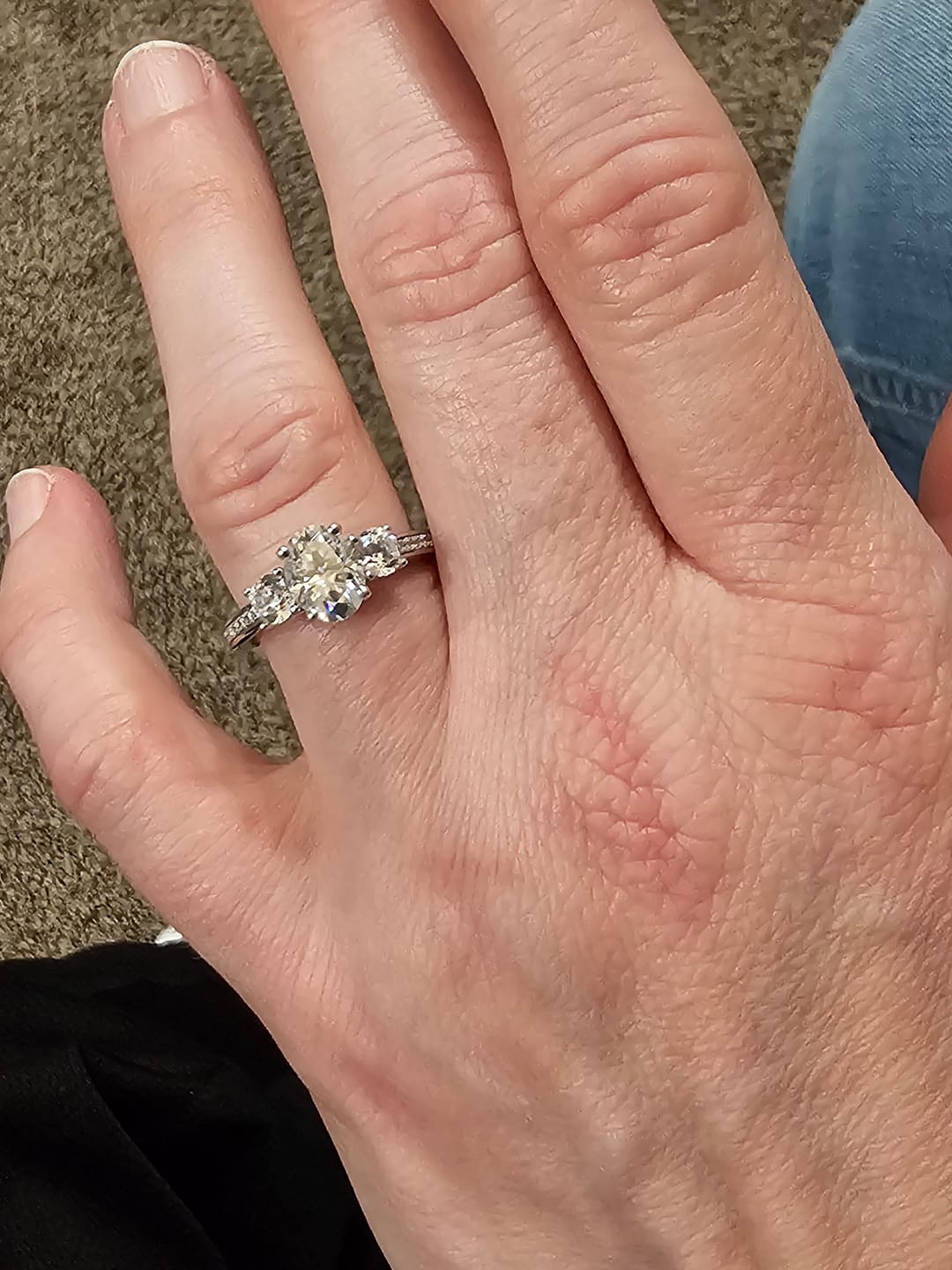 Customer photo review of Three Stone Oval Moissanite Channel-Set Engagement Ring