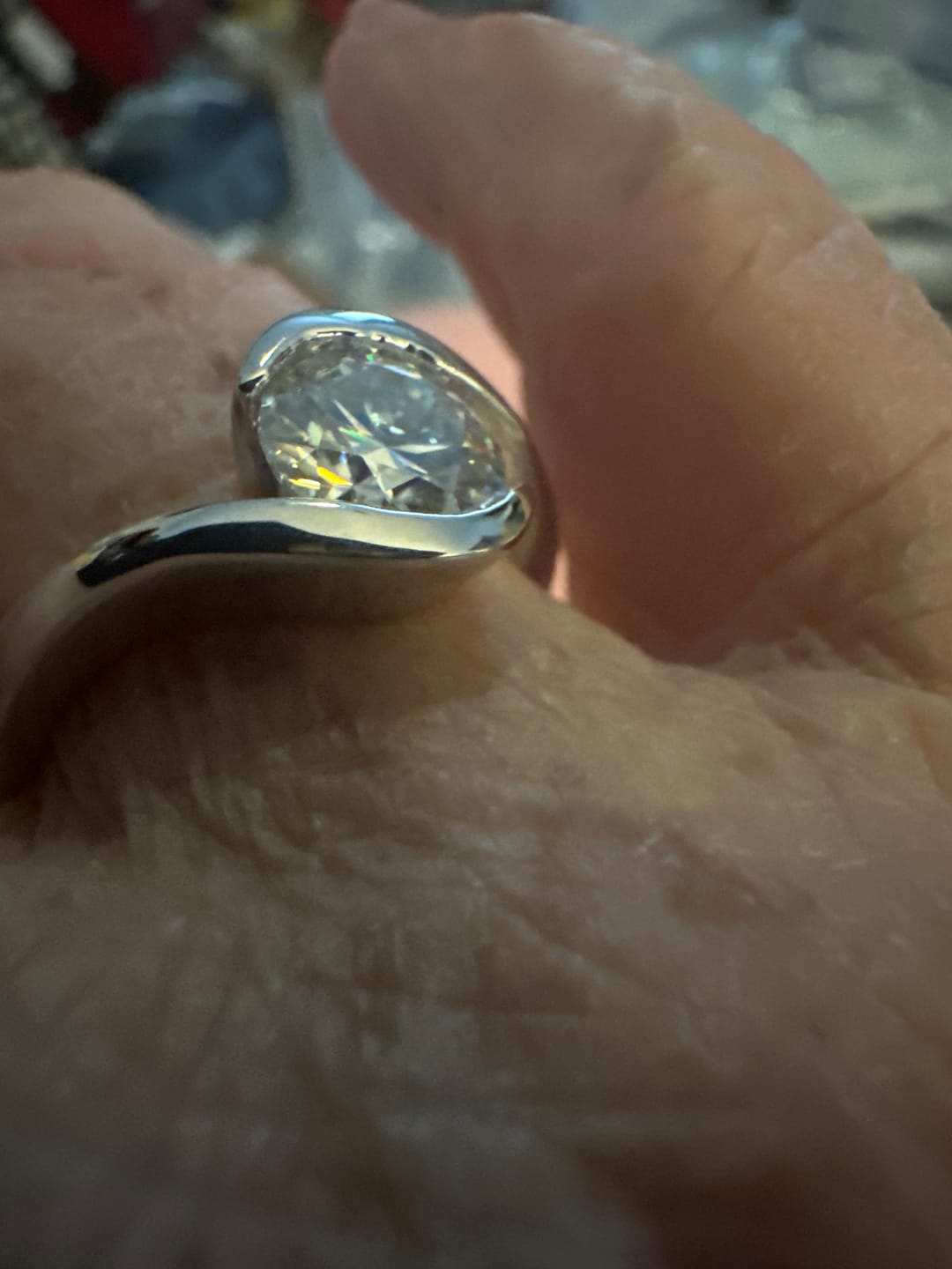 Customer photo review of Solitaire Tension Set Moissanite Bypass Engagement Ring