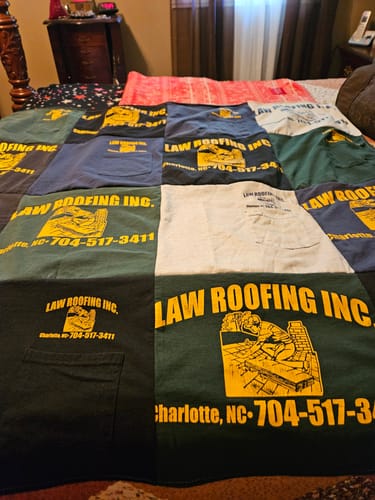 T-shirt quilt with roofing, construction themes by Ann from NC