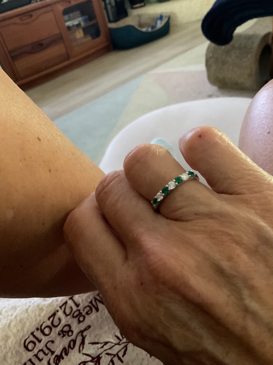 Customer photo review of Alternating Moissanite And Emerald Half Eternity Wedding Band Ring