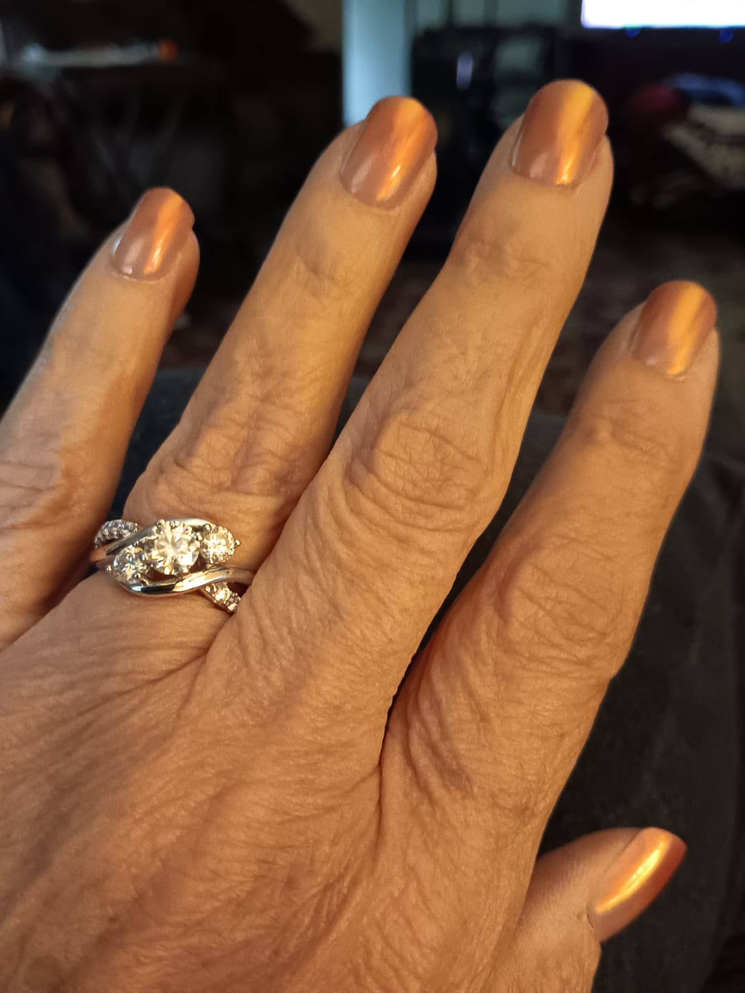 Customer photo review of Swirl Three Stone Moissanite Twisted Pave Engagement Ring