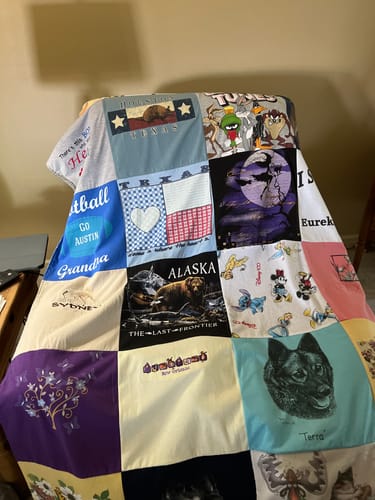 T-shirt quilt with sports, travel themes by Tamina from OK