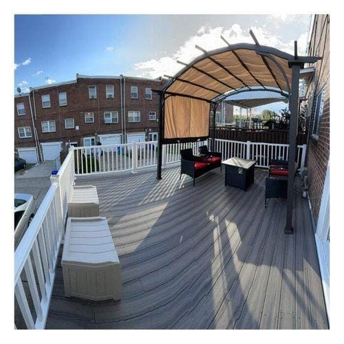 Customer photo review of SUNJOY Outdoor Patio 9.5x11 Modern Tan Metal Arched Pergola Kit with Adjustable Canopy