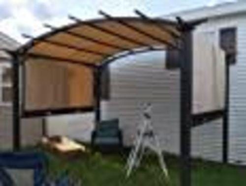 Customer photo review of SUNJOY Outdoor Patio 9.5x11 Modern Tan Metal Arched Pergola Kit with Adjustable Canopy
