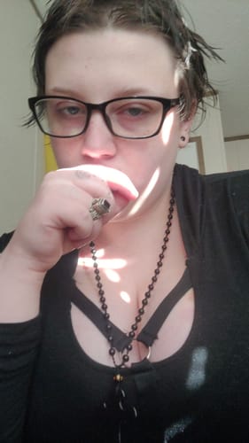 Customer photo review of Carved Obsidian Cross Necklace