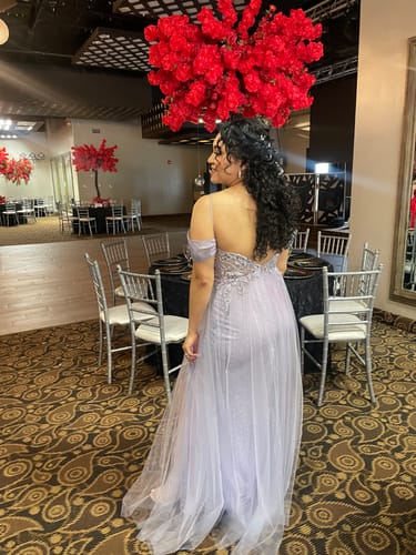 Customer photo review of Natural Black Curly Clip-In Hair Extensions