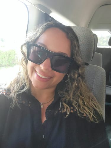 Customer photo review of Dark Ash Brown Curly Clip-In Hair Extensions