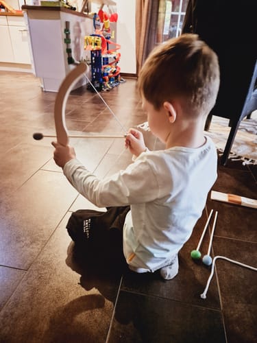 Customer photo review of Pfeil und Bogen Kinder Holzspielzeug mit 5 Pfeilen, Köcher und 3 Zielscheiben