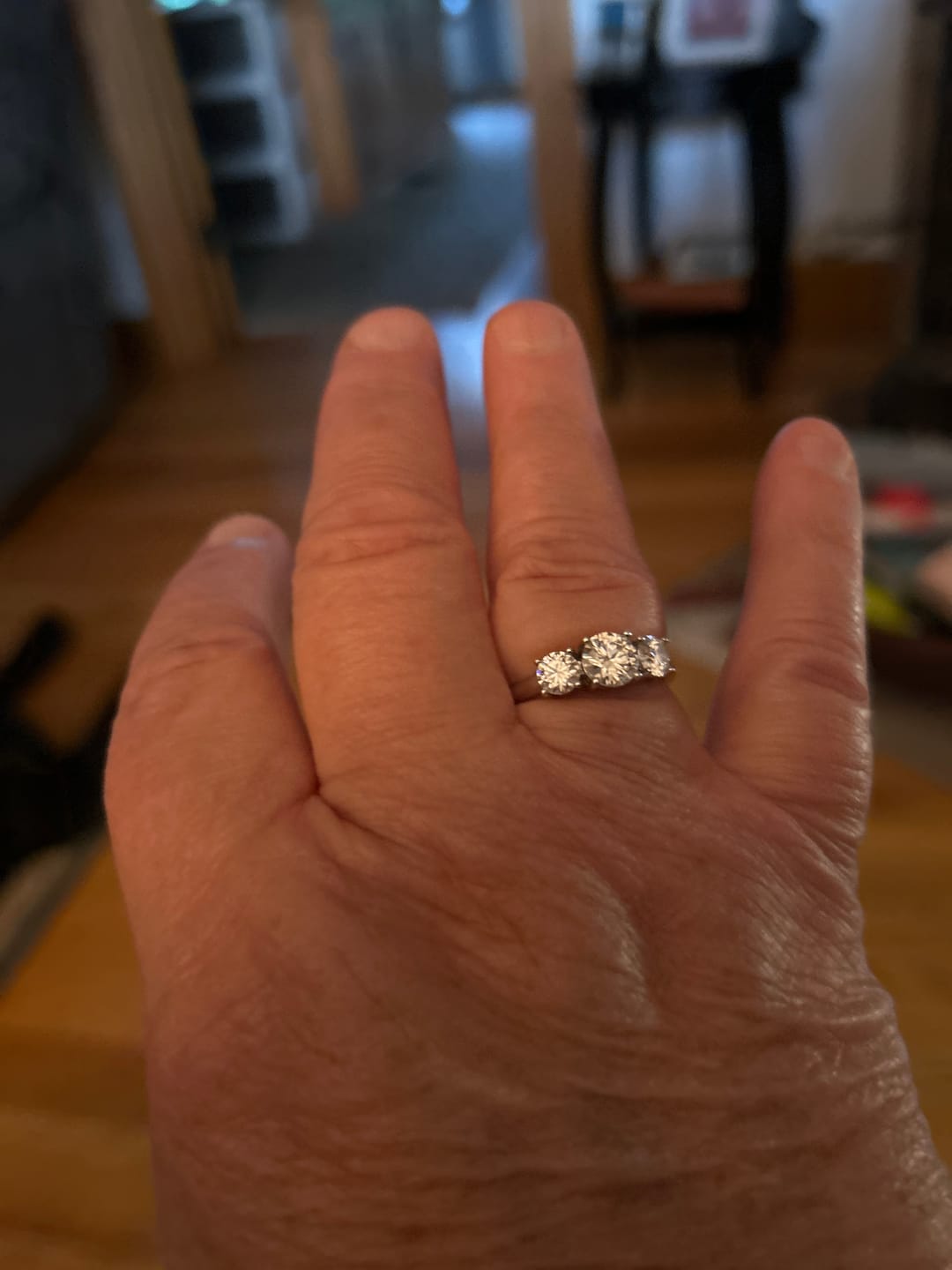 Customer photo review of Classic Three Stone Round Cut Moissanite Engagement Ring