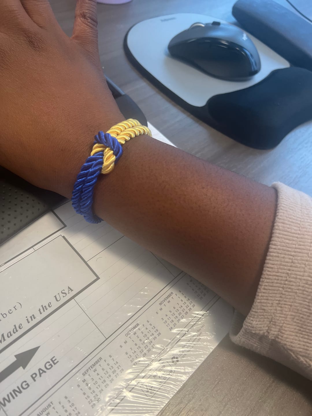 Customer photo review of The Original Love Knot Satin Rope Bracelet- Blue and Gold
