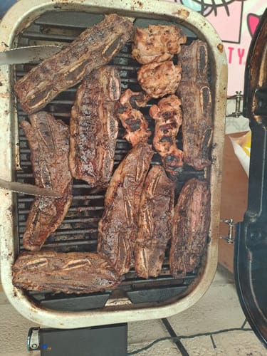Reseña con foto de un cliente sobre Asado de Tira