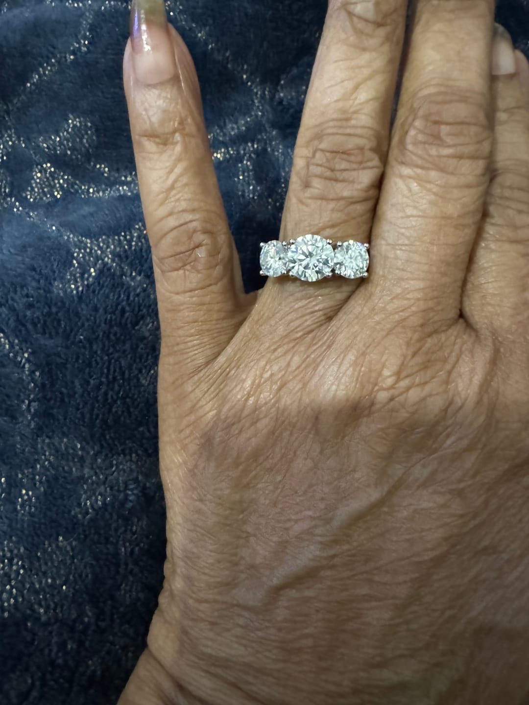Customer photo review of Classic Three Stone Round Cut Moissanite Engagement Ring