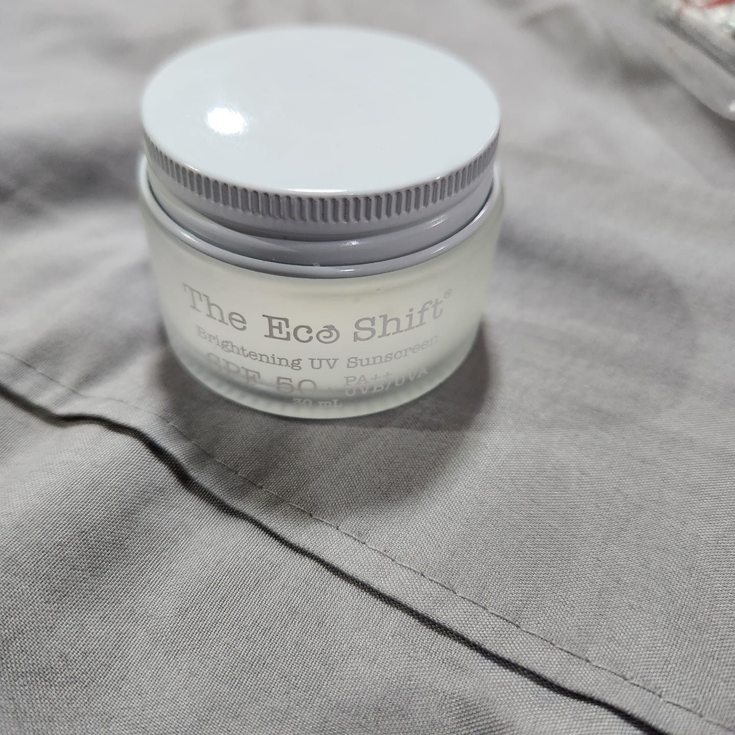 Customer photo review of Brightening UV Sunscreen & Skin Primer with SPF 50