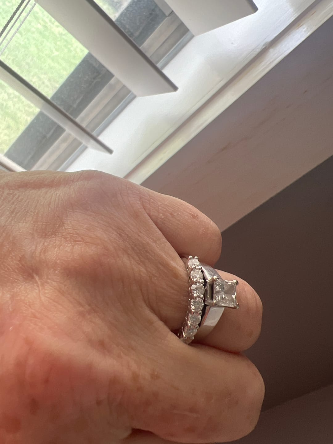 Customer photo review of Round Moissanite Sterling Silver Wedding Band Stackable Ring