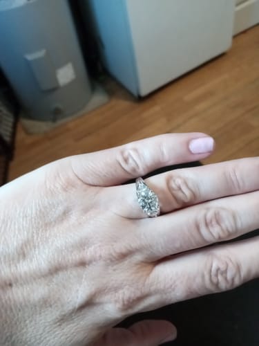 Customer photo review of Three Stone Round Moissanite And Trillion Accents Engagement Ring