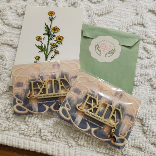 Customer photo review of Enhypen 2023 World Tour Enamel Pins