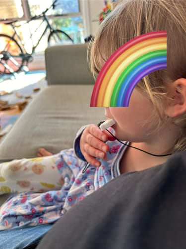 Customer photo review of Rainbow Chew Pendant