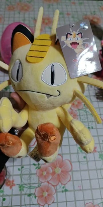 Customer photo review of Meowth Plush 2024